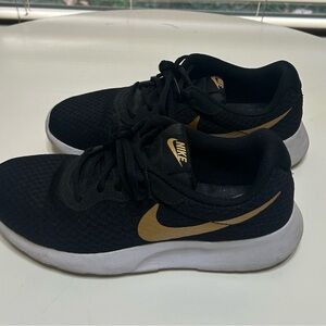 Nike Black Sneakers with Gold Swoosh
